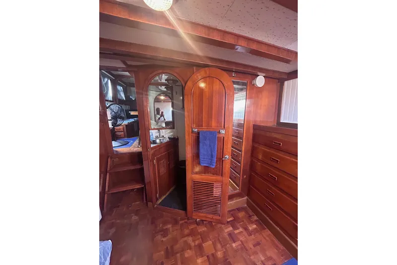 Slide: The Image of 1977 Marine Trader 40 Double Cabin interior with wooden cabinetry and cozy design. - 24