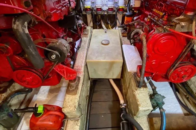 Slide: The Image of Engine room of 1977 Marine Trader 40 Double Cabin with red machinery components. - 35