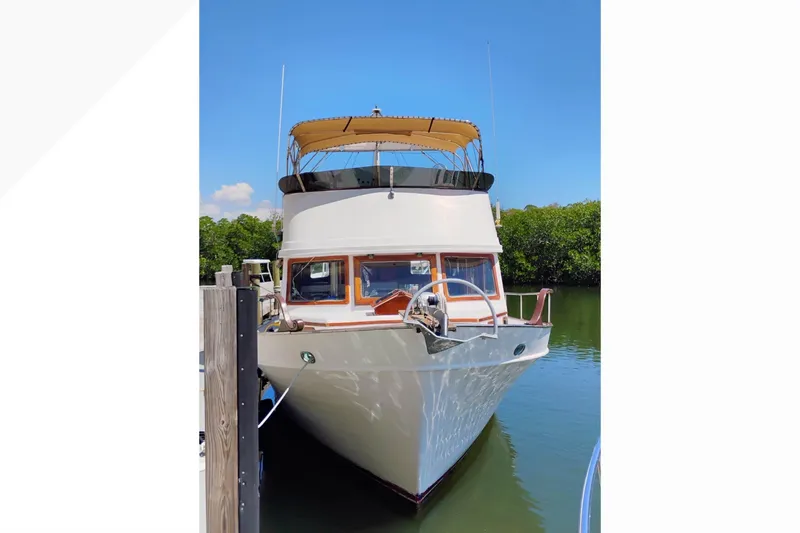 Slide: The Image of 1977 Marine Trader 40 Double Cabin yacht docked on a sunny day. - 38