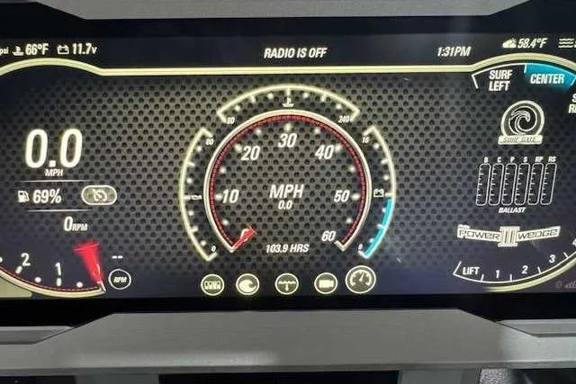 Slide: The Image of Dashboard of a 2022 Malibu M240 boat displaying speedometer and control settings. - 11