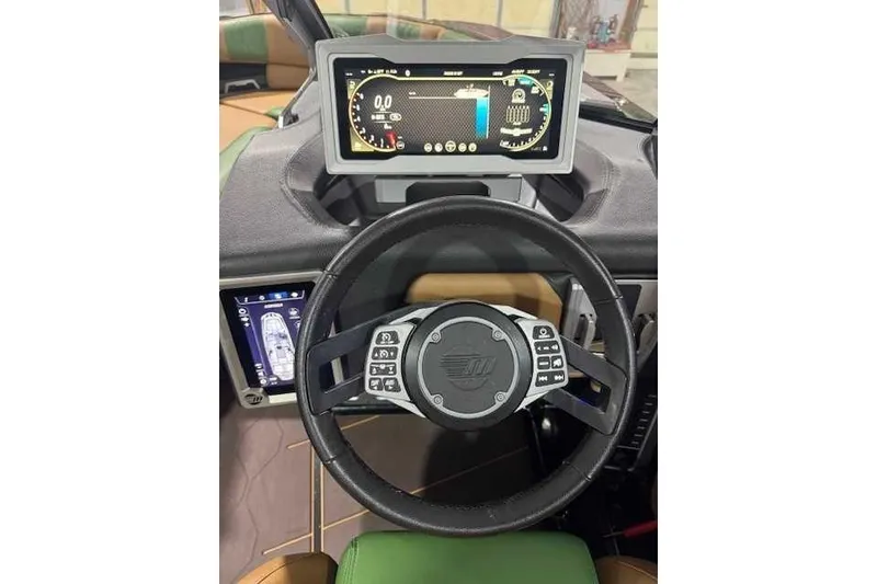 Slide: The Image of 2022 Malibu M240 dashboard with digital display and steering wheel controls. - 2
