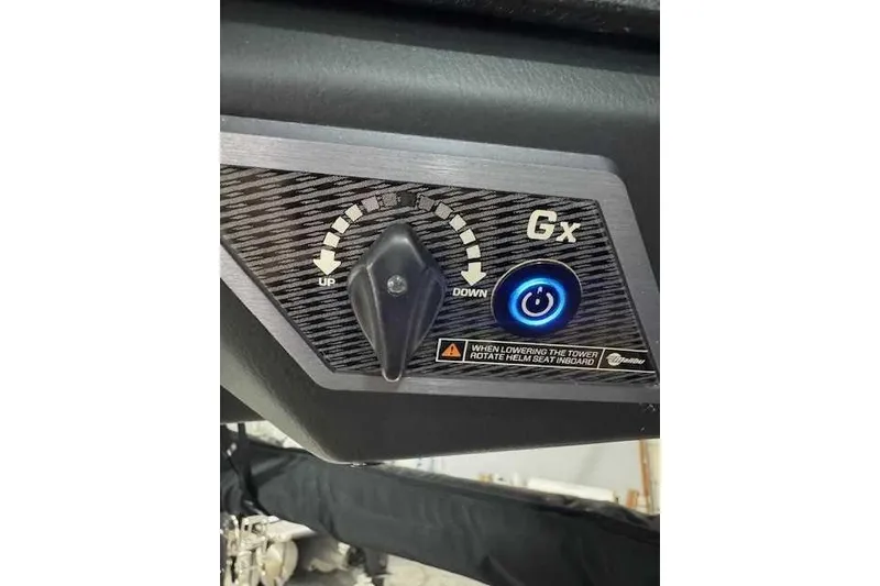 Slide: The Image of 2022 Malibu M240 control panel with power button and adjustment knob. - 9