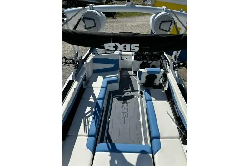 Slide: The Image of 2024 Axis T235 boat interior with blue and white seating, featuring a sleek design. - 3
