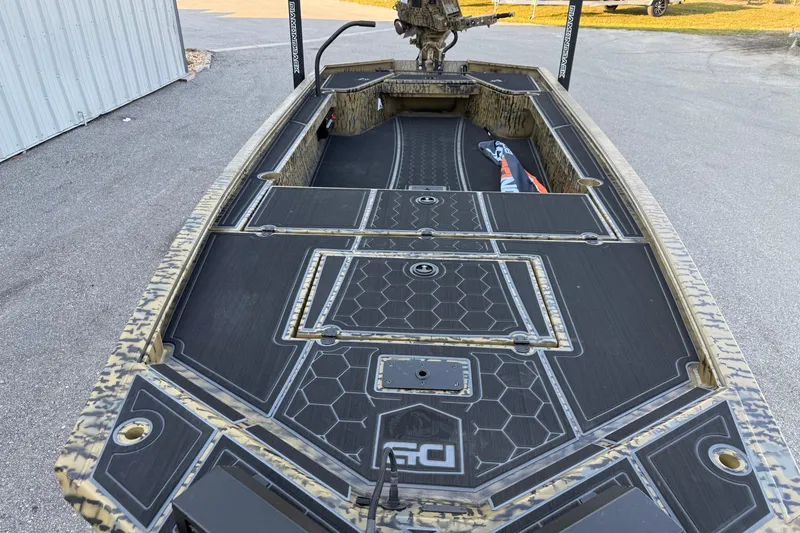 Slide: The Image of 2025 Diamondback Mud Rattler 1860 boat with sleek black and camo design. - 5