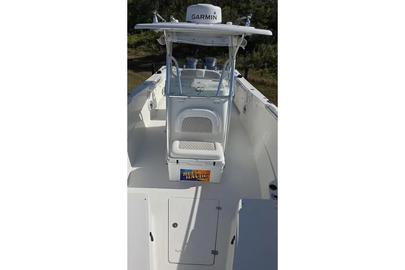 Slide: The Image of 2013 Sailfish 320 CC boat with Garmin equipment, center console view. - 37