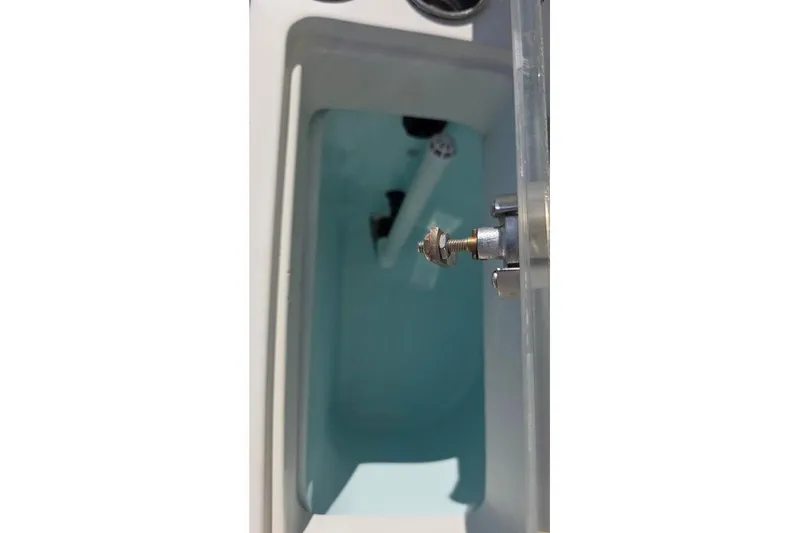 Slide: The Image of Livewell compartment on a 2013 Sailfish 320 CC boat, filled with water. - 41