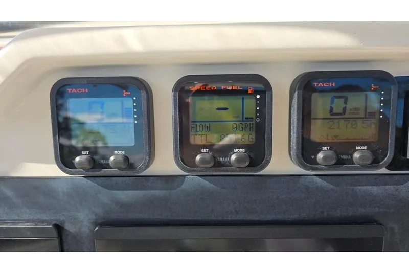 Slide: The Image of Dashboard of 2013 Sailfish 320 CC boat with Yamaha gauges displaying tachometer and fuel data. - 51