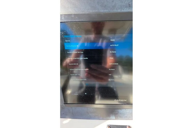 Slide: The Image of Garmin navigation display on 2013 Sailfish 320 CC boat, showing device settings. - 72