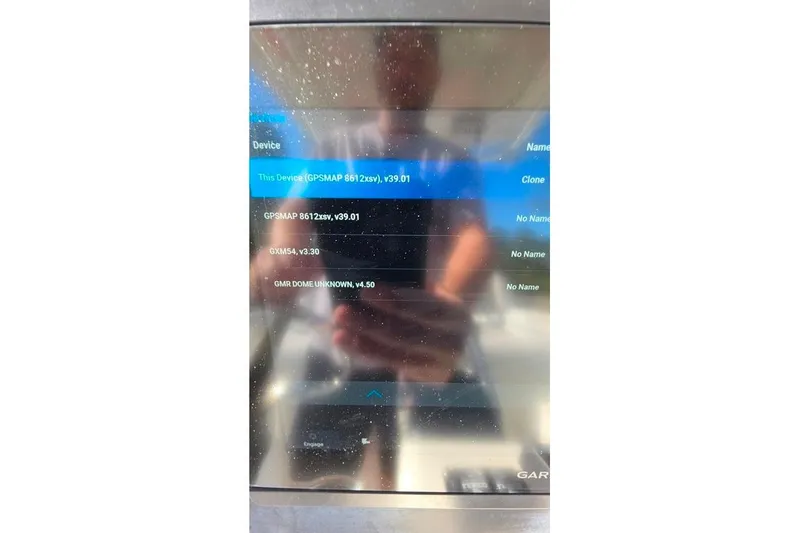 Slide: The Image of Boat GPS display showing device information on a 2013 Sailfish 320 CC. - 73