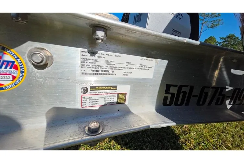 Slide: The Image of Trailer label with specifications and contact number, Sailfish 320 CC, 2013 model. - 81