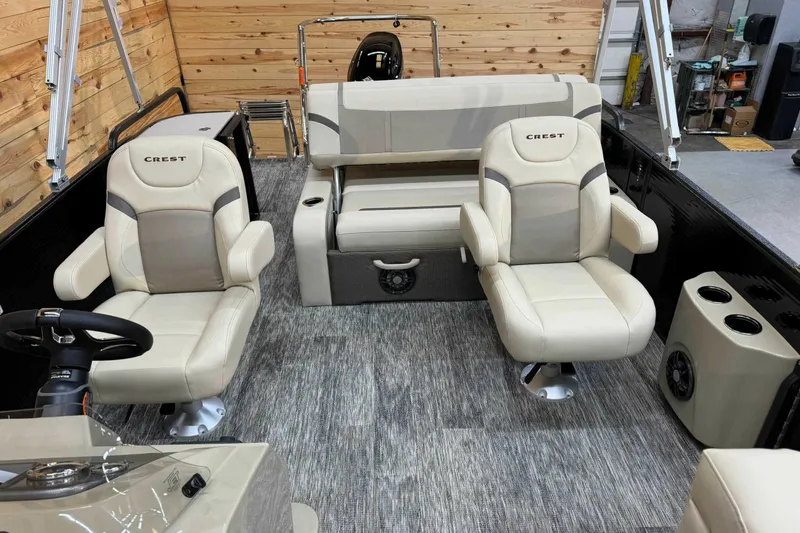 Slide: The Image of 2024 Crest Classic LX 220 SLSC boat interior with plush seating and modern design. - 6