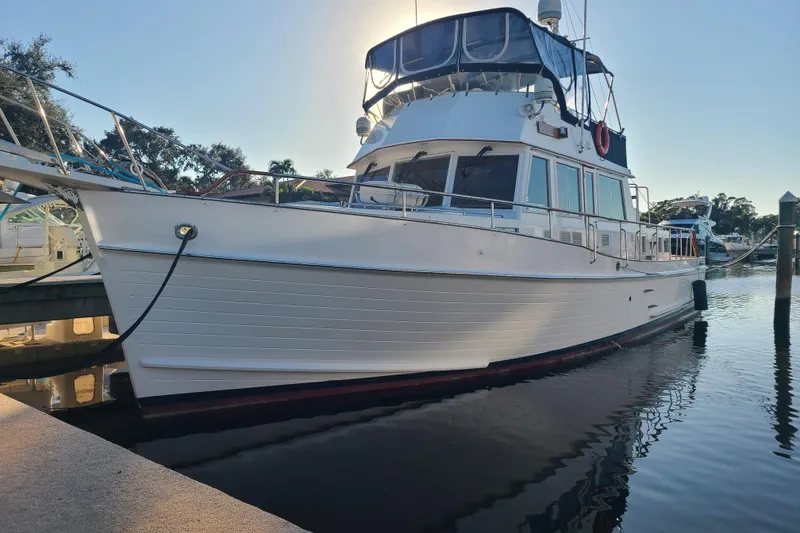 Slide: The Image of 2000 Grand Banks 46 Classic yacht docked in a marina, side view. - 2