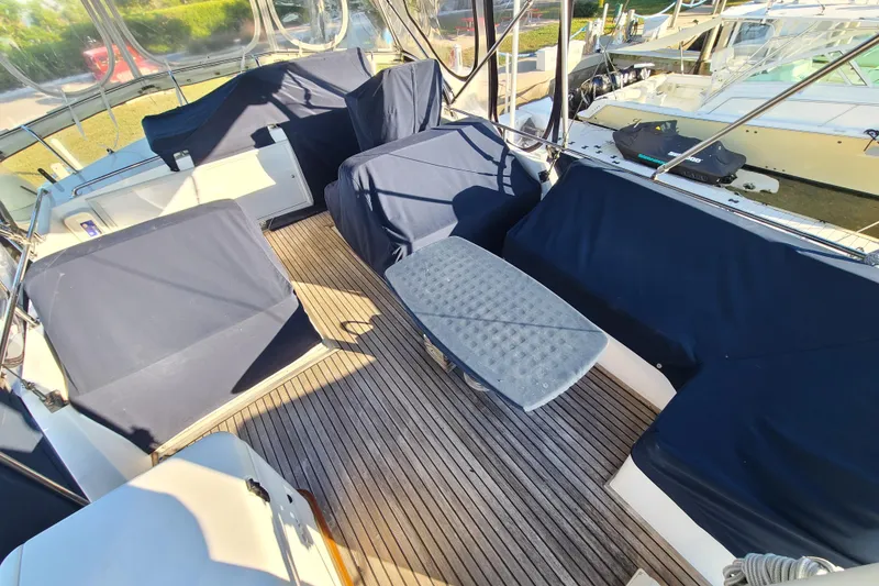 Slide: The Image of Spacious deck of 2000 Grand Banks 46 Classic yacht with covered seating. - 22