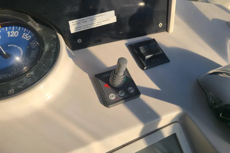 Slide: The Image of Control panel of a 2000 Grand Banks 46 Classic yacht with joystick and compass. - 25