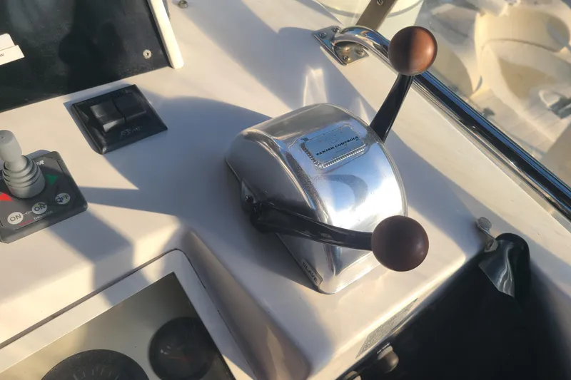 Slide: The Image of Control panel of a 2000 Grand Banks 46 Classic yacht with throttle levers. - 26
