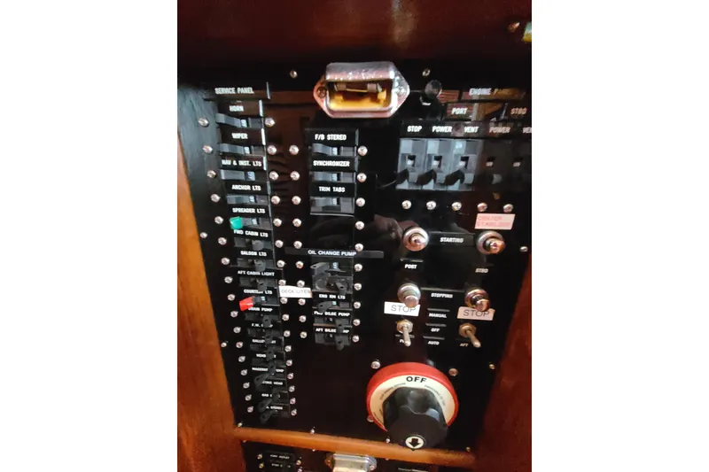 Slide: The Image of Control panel of a 2000 Grand Banks 46 Classic yacht with switches and indicators. - 36