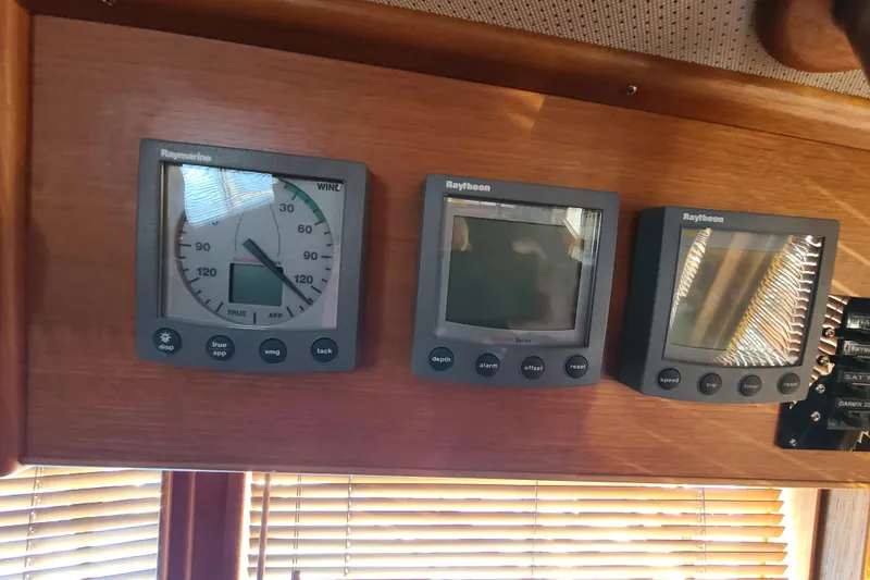 Slide: The Image of Raymarine instruments on a 2000 Grand Banks 46 Classic yacht dashboard. - 39