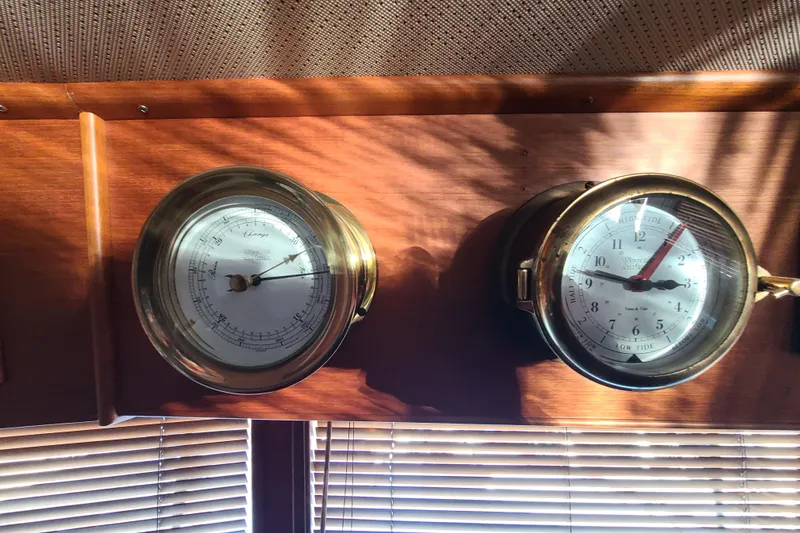 Slide: The Image of Brass barometer and clock on Grand Banks 46 Classic yacht, 2000 model. - 41