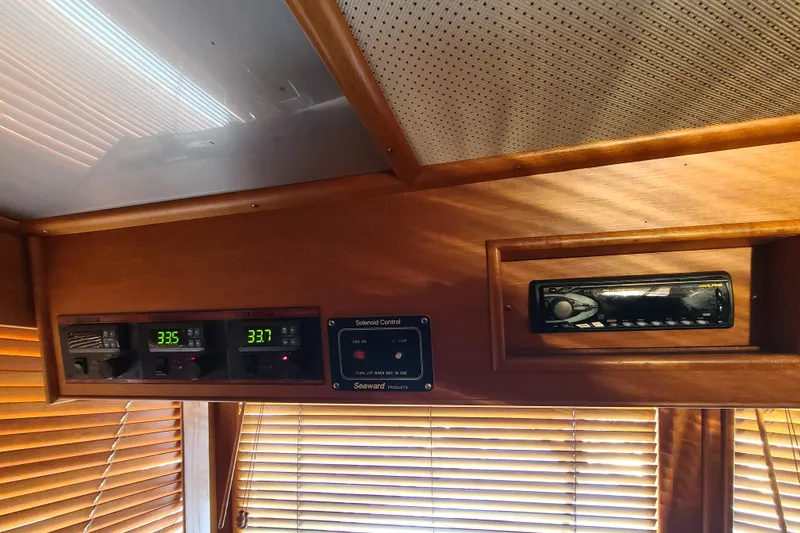 Slide: The Image of Interior of 2000 Grand Banks 46 Classic yacht with control panel and stereo system. - 42