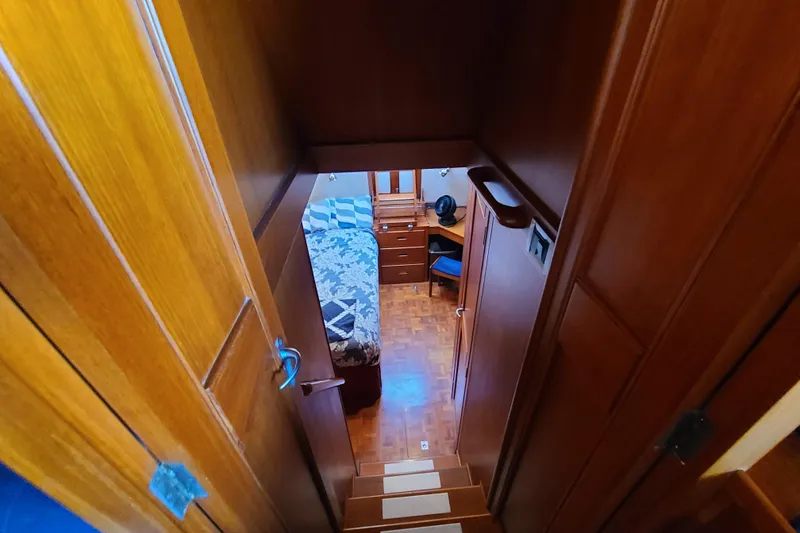 Slide: The Image of Interior view of 2000 Grand Banks 46 Classic yacht cabin with wooden finish. - 46