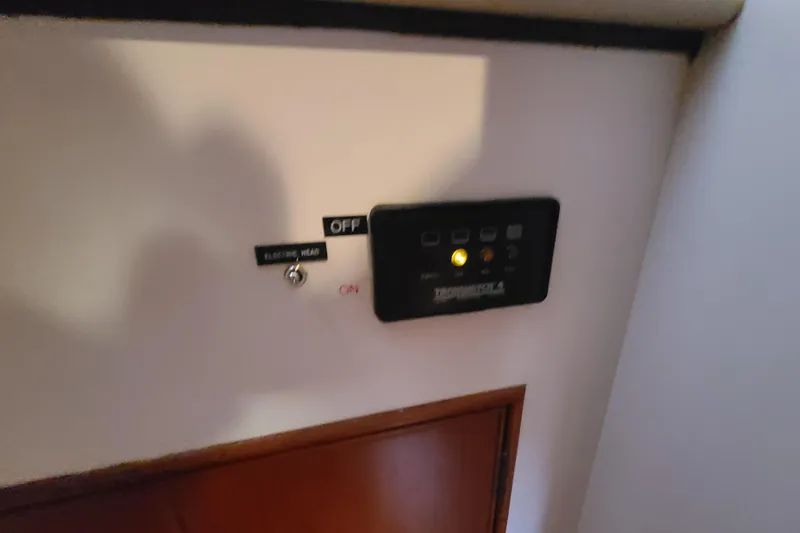 Slide: The Image of Control panel and switch inside a 2000 Grand Banks 46 Classic yacht. - 50