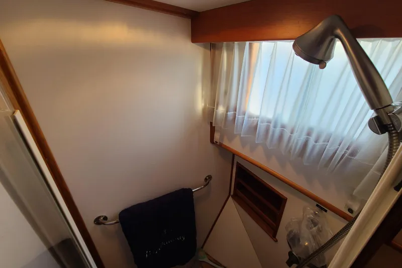 Slide: The Image of Bathroom interior of 2000 Grand Banks 46 Classic yacht with shower and window. - 58