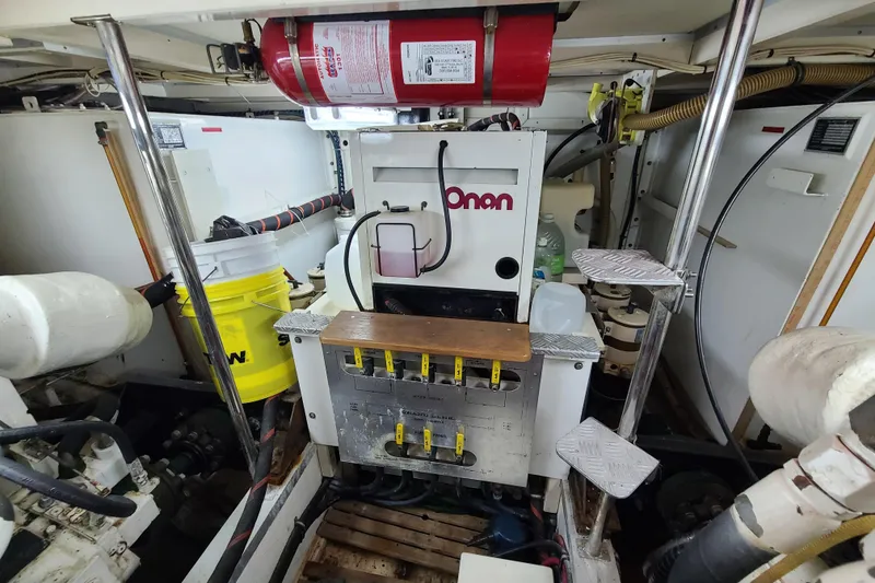 Slide: The Image of Engine room of 2000 Grand Banks 46 Classic with Onan generator and equipment. - 77