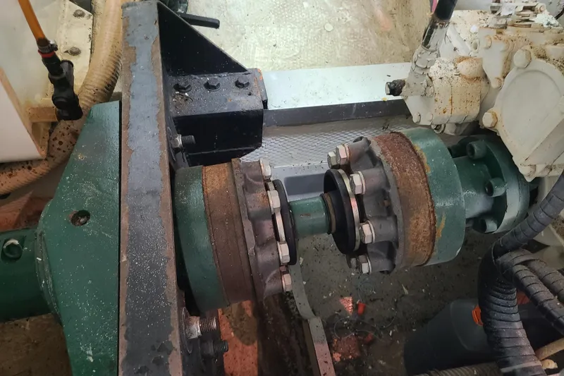 Slide: The Image of Engine component of a 2000 Grand Banks 46 Classic boat, showing mechanical parts and connections. - 88