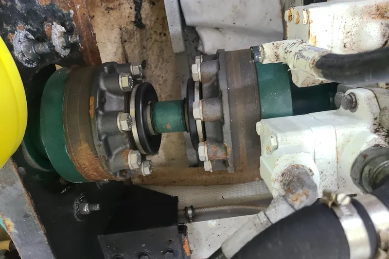 Slide: The Image of Engine component of a 2000 Grand Banks 46 Classic boat, showing mechanical details. - 90