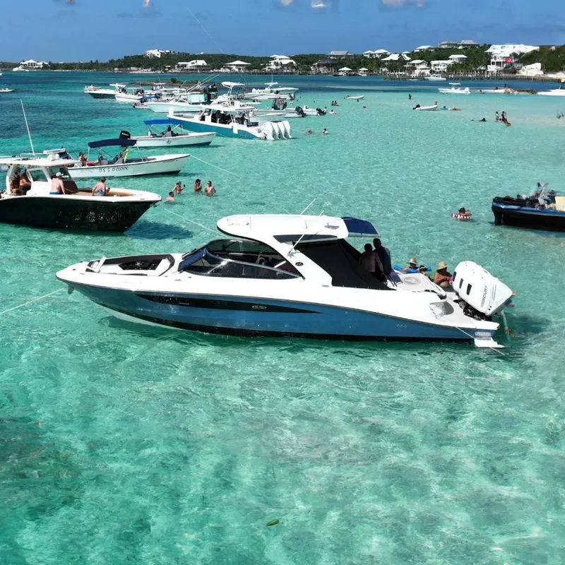 The Image of Boats anchored in clear turquoise water, featuring a 2018 Sae Ray 38SLV OB model. - 0