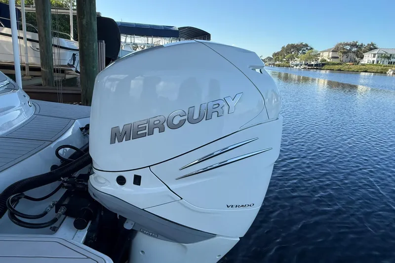 Slide: The Image of 2018 Sae Ray 38SLV OB with Mercury Verado outboard engine by the water. - 16