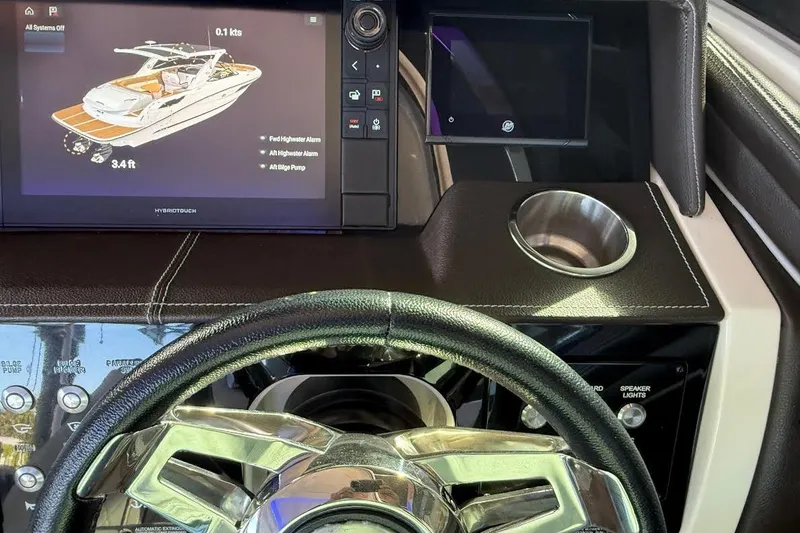 Slide: The Image of Dashboard of 2018 Sae Ray 38SLV OB boat with touchscreen display and steering wheel. - 19