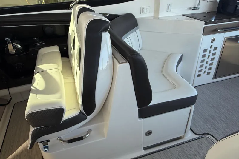 Slide: The Image of Luxurious seating area on 2018 Sea Ray 38SLV OB boat, featuring modern design and comfort. - 25