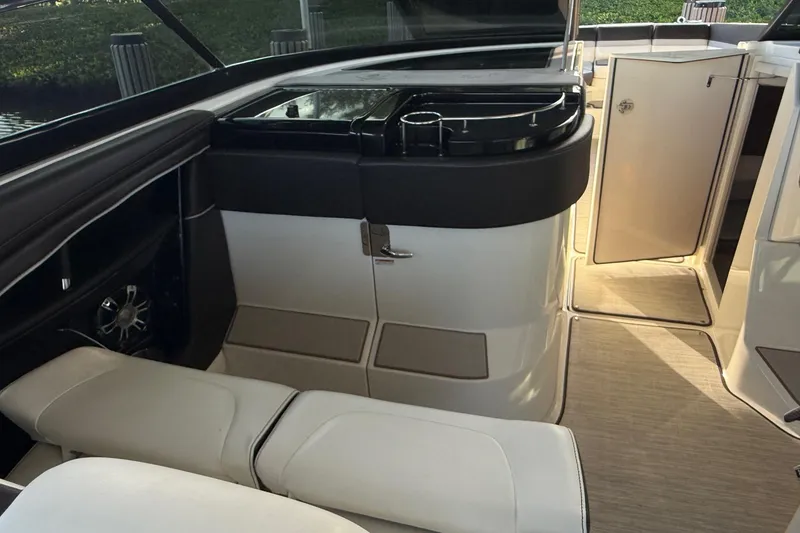 Slide: The Image of Interior of 2018 Sea Ray 38SLV OB boat with seating and storage compartments. - 29