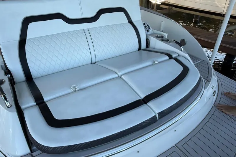 Slide: The Image of Luxurious seating on 2018 Sea Ray 38SLV OB boat, featuring white upholstery and black accents - 30