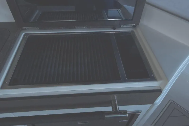 Slide: The Image of Built-in grill on 2018 Sea Ray 38SLV OB boat, featuring sleek design and functionality. - 38