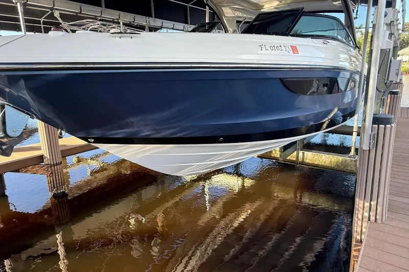 Slide: The Image of 2018 Sae Ray 38SLV OB boat docked, featuring sleek design and modern aesthetics. - 4