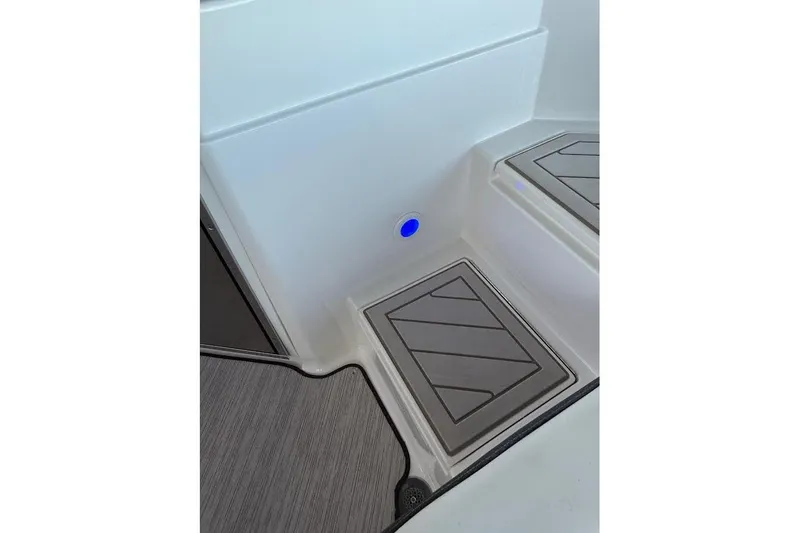 Slide: The Image of Interior view of 2018 Sae Ray 38SLV OB boat with modern flooring and blue LED light. - 45