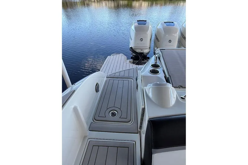 Slide: The Image of 2018 Sae Ray 38SLV OB boat with twin outboard motors on calm water. - 47