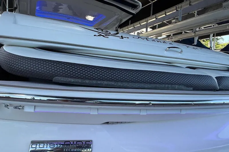 Slide: The Image of 2018 Sae Ray 38SLV OB boat with Quiet Ride Technology, docked under a canopy. - 52
