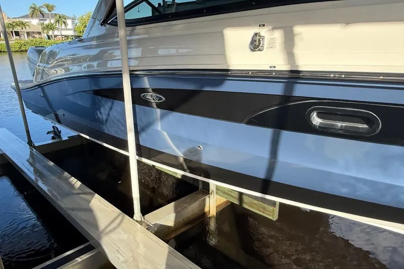 Slide: The Image of 2018 Sae Ray 38SLV OB boat docked on a sunny day. - 9