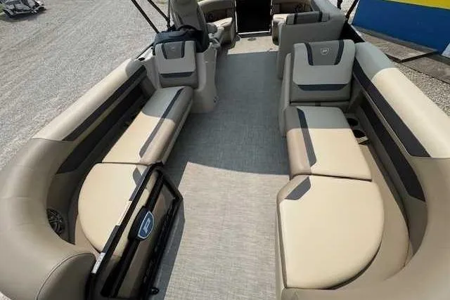Slide: The Image of 2025 Premier 200 Sunscape boat interior with beige seating and modern design. - 4