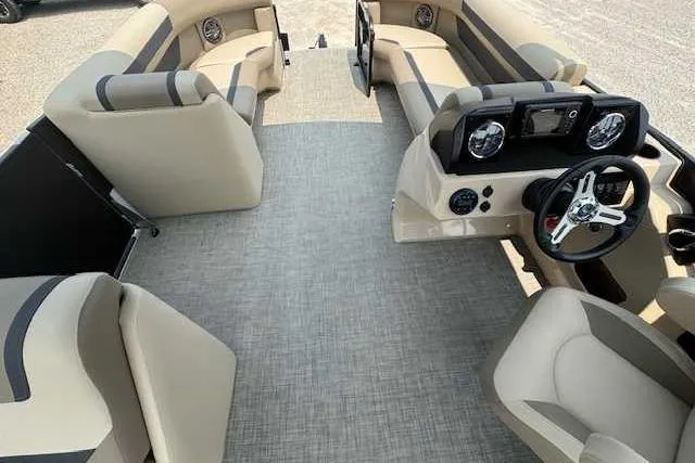 Slide: The Image of 2025 Premier 200 Sunscape boat interior with beige seating and modern dashboard. - 5