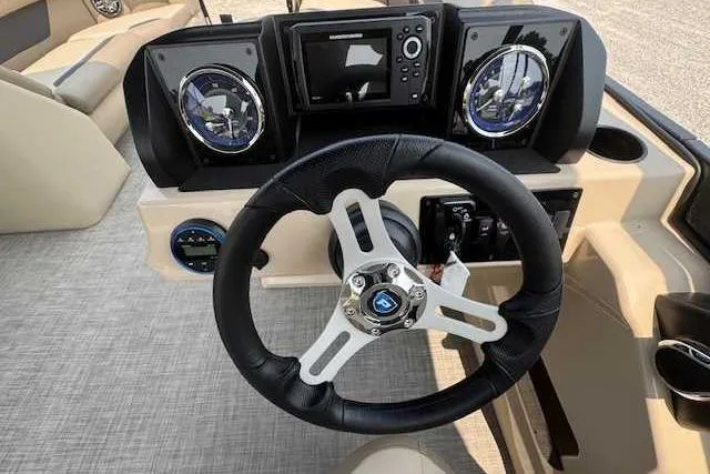 Slide: The Image of Steering console of 2025 Premier 200 Sunscape boat with modern controls and navigation system. - 7