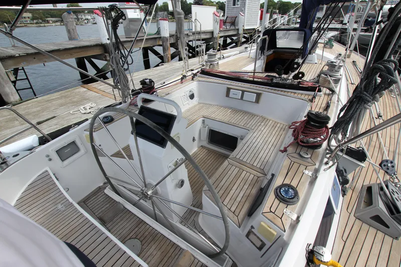 Slide: The Image of Cockpit of 1989 Nautor Swan 53 sailboat with wooden deck and steering wheel. - 13