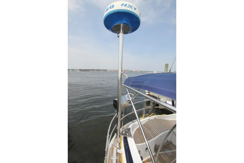 Slide: The Image of Nautor Swan 53 (1989) yacht with radar, docked by calm waters. - 16