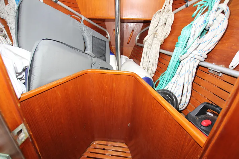 Slide: The Image of Interior of 1989 Nautor Swan 53 sailboat with ropes and cushions stored neatly. - 23