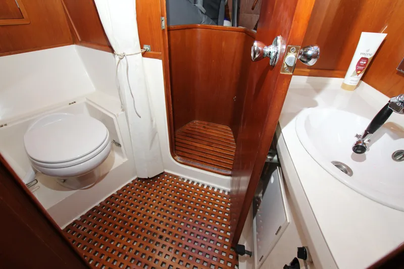 Slide: The Image of Bathroom interior of 1989 Nautor Swan 53 yacht with wooden accents and modern fixtures. - 24