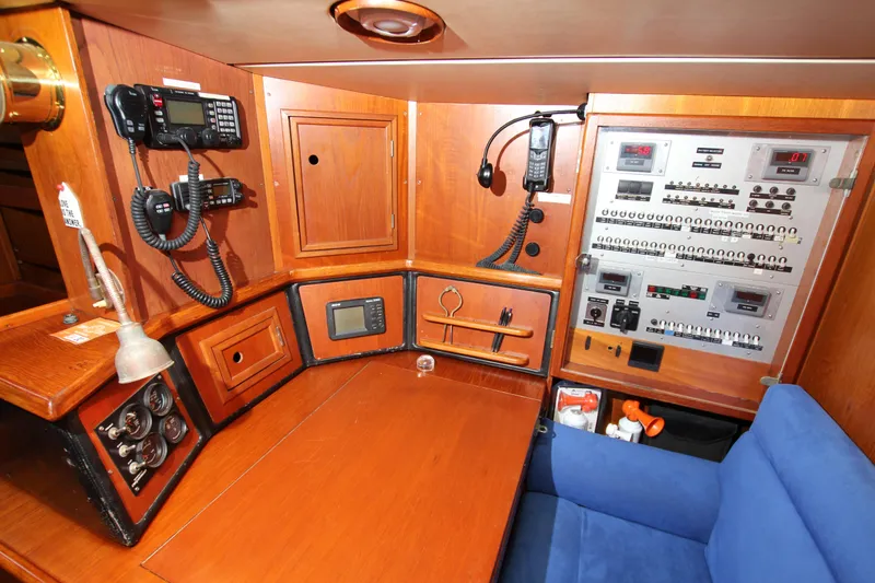 Slide: The Image of Navigation station of 1989 Nautor Swan 53 yacht with control panels and communication equipment. - 35