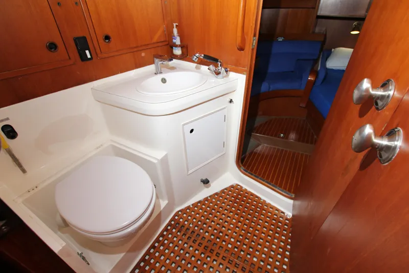 Slide: The Image of Bathroom interior of 1989 Nautor Swan 53 yacht with wooden accents and modern fixtures. - 40